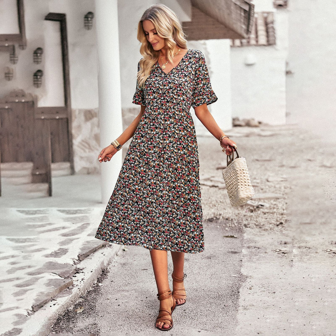 Damen Midi-Kleid mit floralem Muster und verspieltem V-Ausschnitt W&W Mode